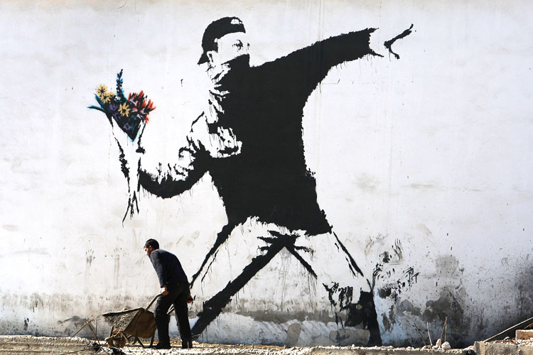 Banksy, pochoir sur un mur en Cisjordanie